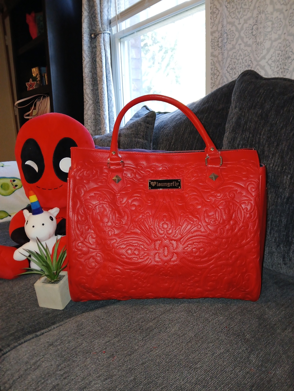 Loungefly Red Embossed Skull Tote Bag with an intricate lattice pattern
